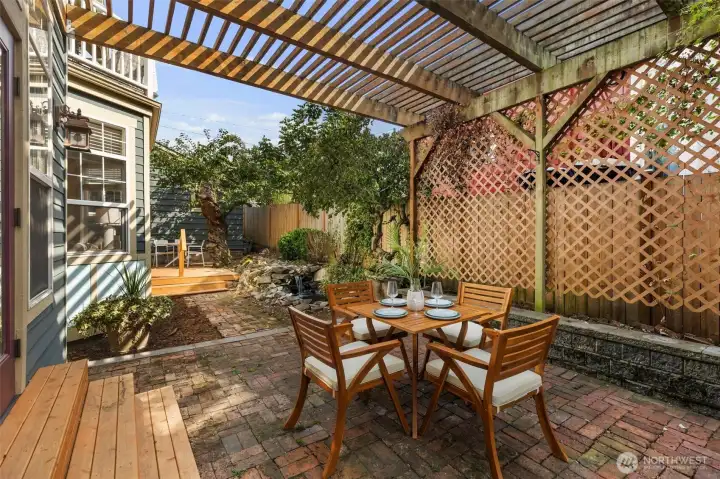Dine al fresco on this beautiful brick patio.