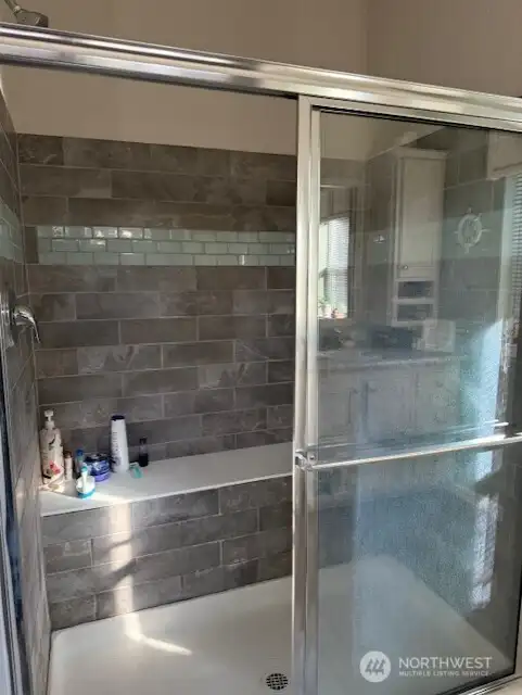 Tiled walk-in shower.