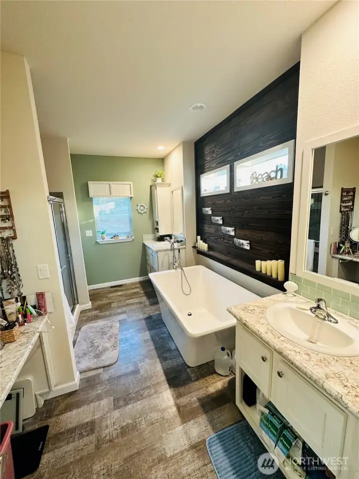 The utility room has extra counter space & storage area, hot water heater has a storage area cabinet for extra storage.