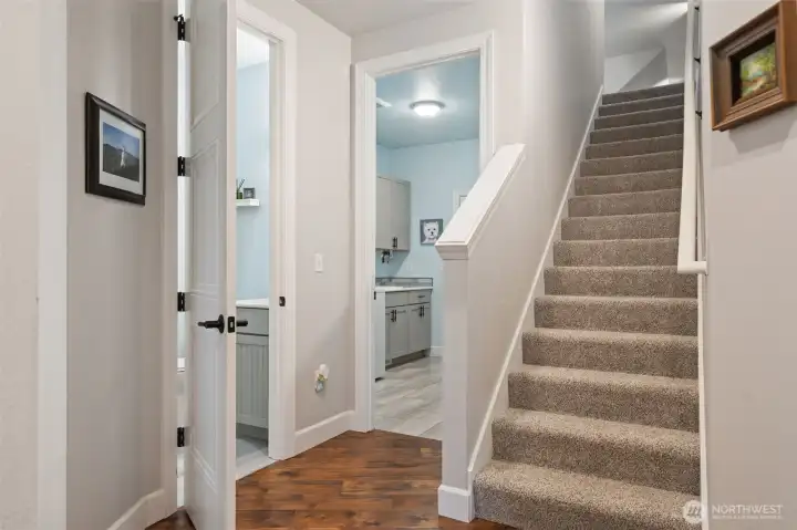 Door to the left is 3/4 bathroom, door straight ahead is mud room.