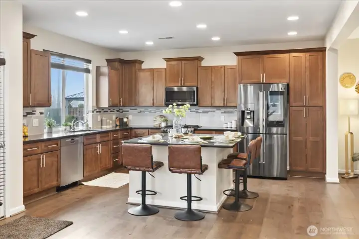 Modern kitchen offers amble counter space and cabinet storage.