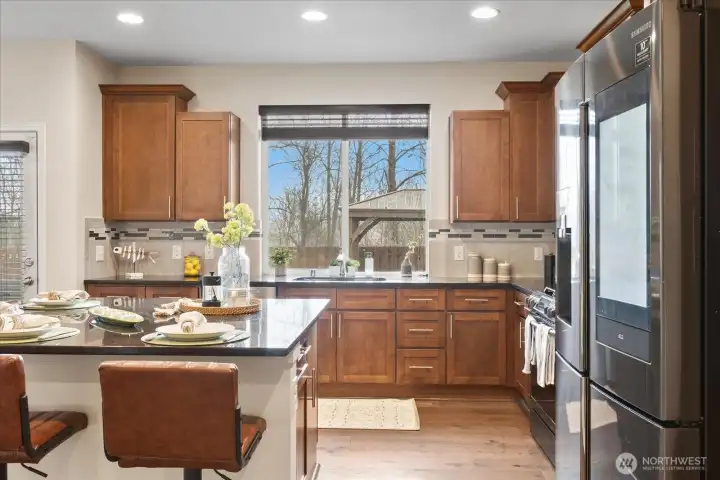 Stainless steel appliances with smart fridge.