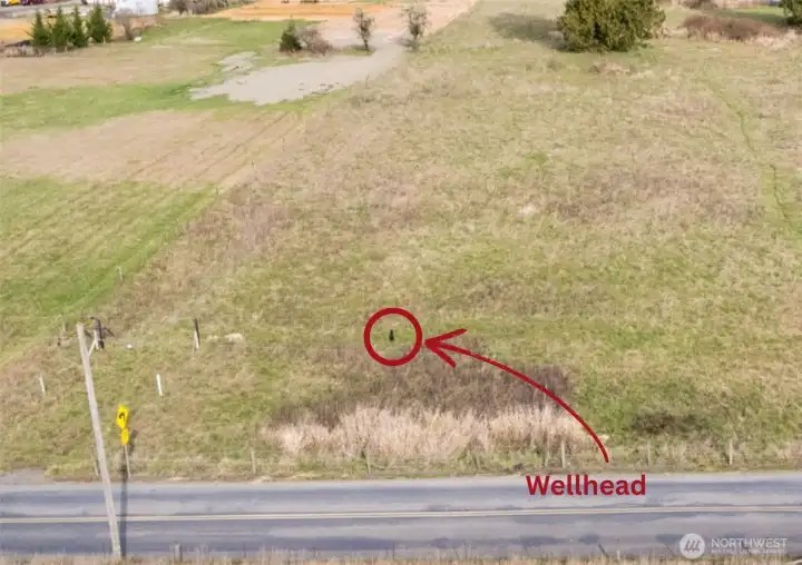 Well head at front of property to the right