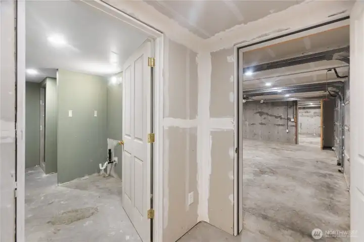 Unfinished hallway & bathroom on garage level