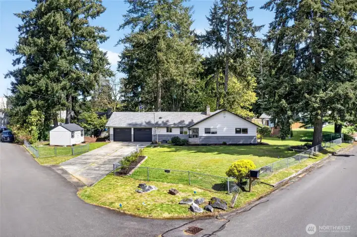 Situated on a large corner lot and fully fenced for your fur babies!