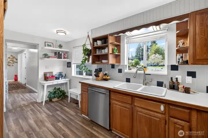 Thoughtfully positioned kitchen corner could easily accommodate a quaint seating area or sunny breakfast nook.