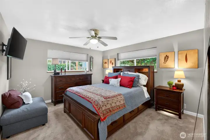 Well-sized primary suite offering a bright & airy feel w/2 corner windows, including one with peaceful backyard views, and complimented by a private EnSuite bath.