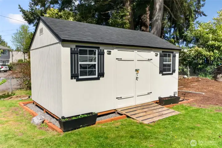 Young shed stays with the property for storage!