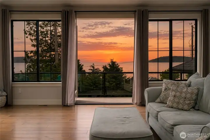 Sunset serenity with panoramic water views from this cozy living room. Sunset serenity with panoramic water views from this cozy living room.