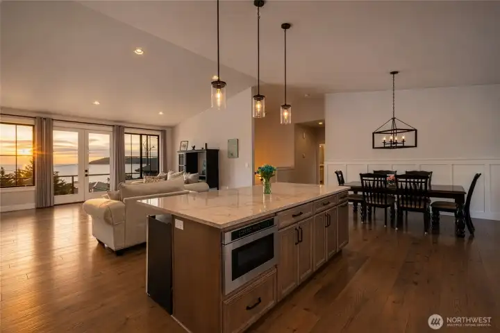 Spacious open-concept living with stunning sunset water views. Spacious open-concept living with stunning sunset water views.