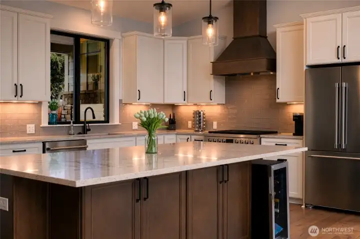 Designer kitchen with quartz island and premium finishes throughout. Designer kitchen with quartz island and premium finishes throughout.