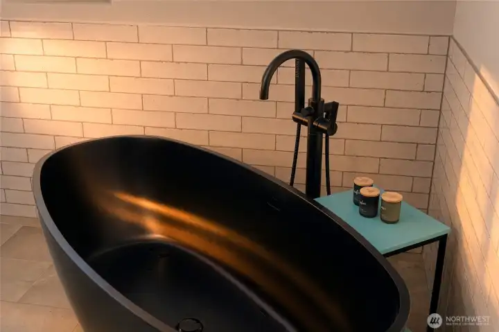 Elegant soaking tub for a spa-like primary bathroom retreat. Elegant soaking tub for a spa-like primary bathroom retreat.
