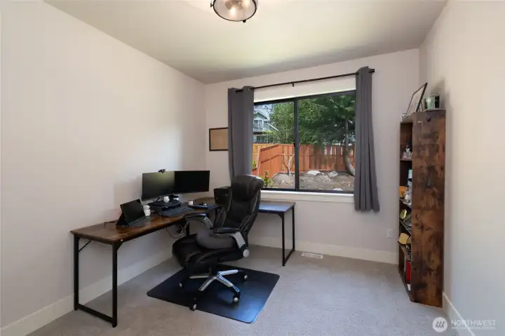 Flexible bonus room perfect for a home office or creative workspace. Flexible bonus room perfect for a home office or creative workspace.