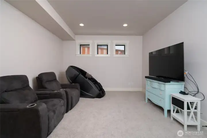 Spacious media room perfect for movie nights and relaxing evenings. Spacious media room perfect for movie nights and relaxing evenings.