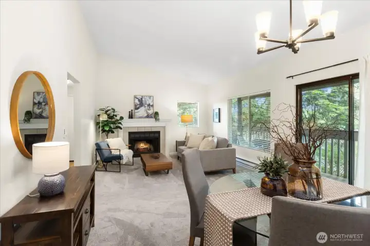 Vaulted ceilings, living to dining room with deck access.