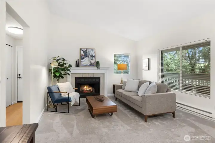 Vaulted ceilings, living to dining room with deck access. Wood burning fireplace.