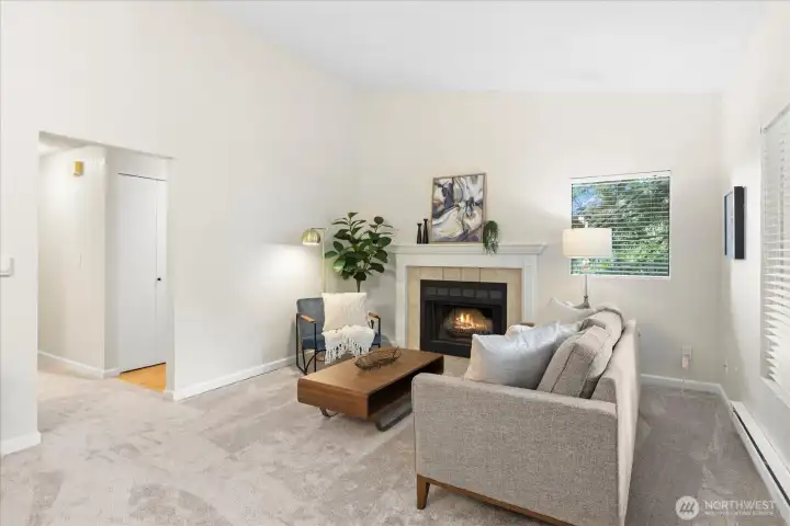 Vaulted ceilings, living to dining room with deck access. Wood burning fireplace.