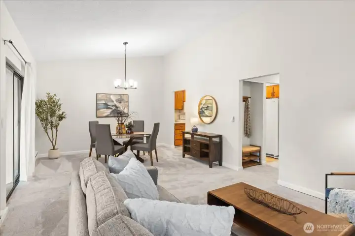 Vaulted ceilings, living to dining room with deck access.