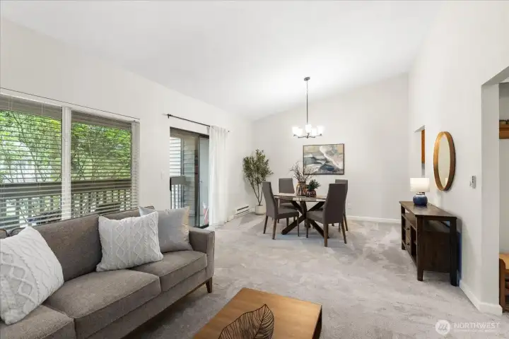 Vaulted ceilings, living to dining room with deck access.