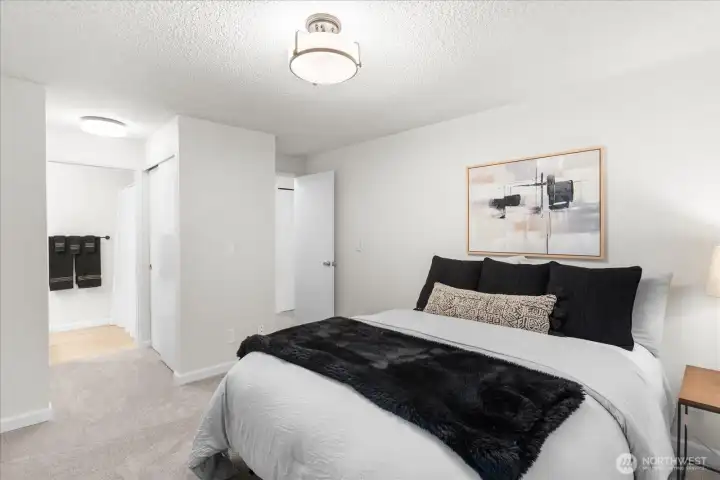 Primary with ensuite offering tree lined views and double closets.