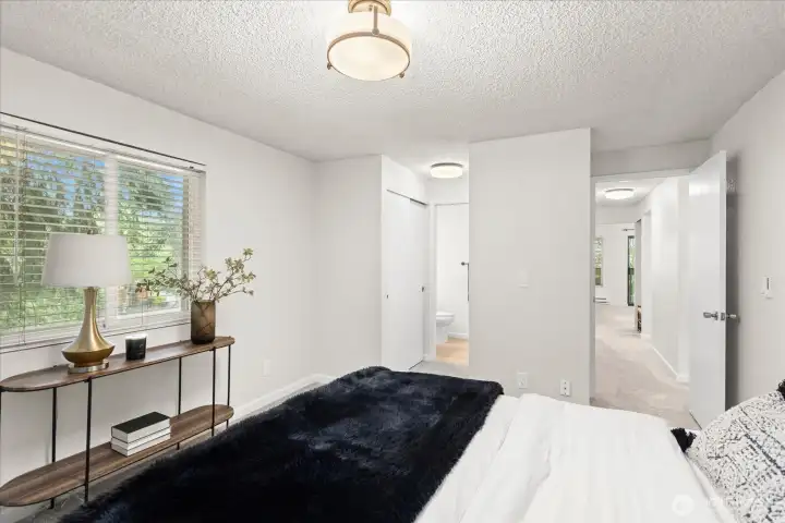 Primary with ensuite offering tree lined views and double closets.