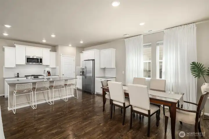 Gorgeous chef's kitchen with quartz counters, pantry, lots of work space and hug island with eating bar