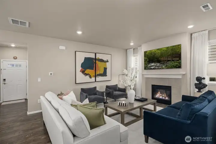 Spacious living room with inviting gas fireplace