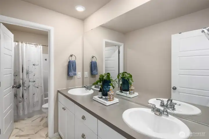 Spacious hall bathroom with double sinks