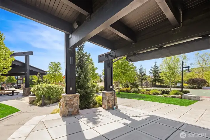 Trails Village Green Park covered picnic areas next to the pickleball and basketball courts