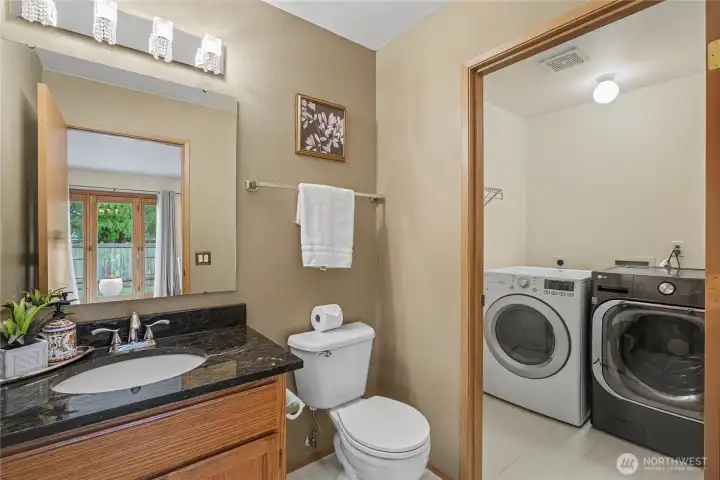 Convenient Bathroom/Utility Room Combination off of the family room