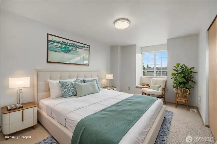 Bedroom with window seat. Digitally staged