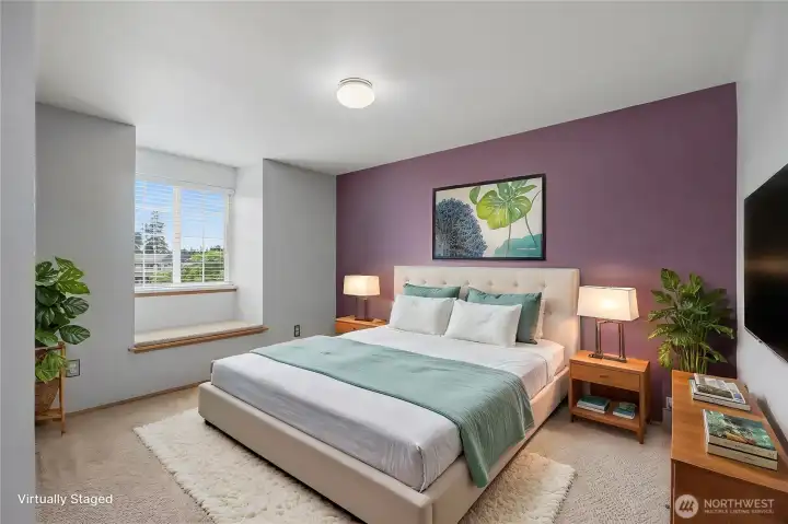 Additional upstairs bedroom with window seat. This photo is digitally staged.