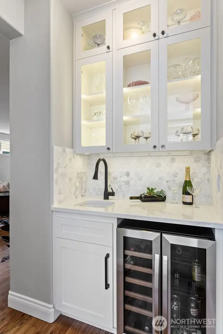 Backlit custom cabinets and wine fridge stays!