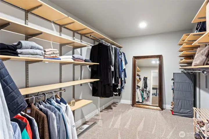 Primary closet with built in organizers. Almost embarrassing how big this room is!