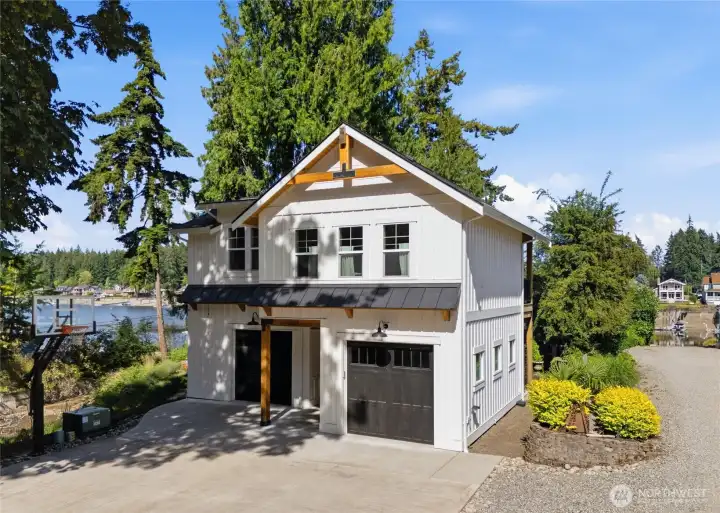 This structure features an 864 sq. ft. guest suite, hobby area, or work-from-home space, complete with a private deck offering elevated waterfront views. This structure features an 864 sq. ft. guest suite, hobby area, or work-from-home space, complete with a private deck offering elevated waterfront views.