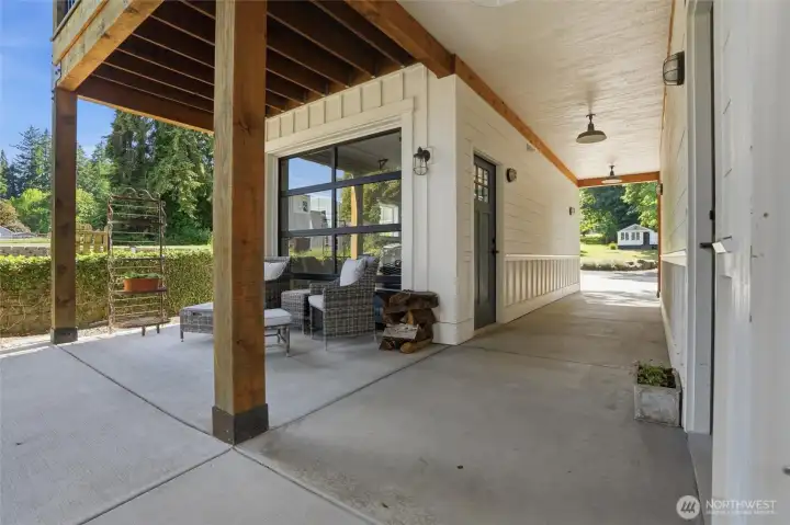 One of two garage spaces enjoys a unique, see-through garage door that seamlessly connects the interior space to the covered patio for effortless indoor-outdoor entertaining. The property also features a versatile detached structure in the backyard, providing ample room for vehicle storage, a boat, or recreational equipment like kayaks and water gear. One of two garage spaces enjoys a unique, see-through garage door that seamlessly connects the interior space to the covered patio for effortless indoor-outdoor entertaining. The property also features a versatile detached structure in the backyard, providing ample room for vehicle storage, a boat, or recreational equipment like kayaks and water gear.