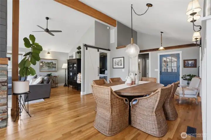 The dining room extends from the front of the home towards the kitchen for seamless entertaining of guests. Gorgeous timber frame beams and real oak hardwood flooring add to the beauty and character of this amazing waterfront bungalow. The dining room extends from the front of the home towards the kitchen for seamless entertaining of guests. Gorgeous timber frame beams and real oak hardwood flooring add to the beauty and character of this amazing waterfront bungalow.