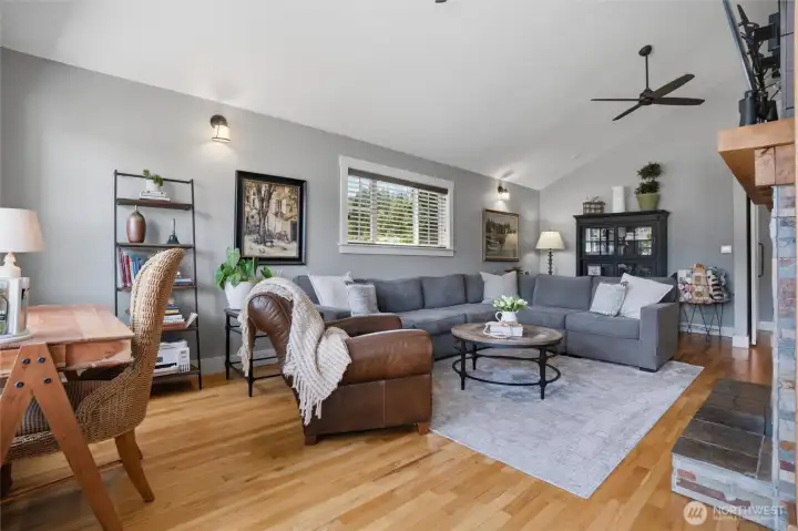 The real oak hardwood floors extend into the main living space. Vaulted ceilings with ceiling fans for air movement add character to this expansive living space. The real oak hardwood floors extend into the main living space. Vaulted ceilings with ceiling fans for air movement add character to this expansive living space.