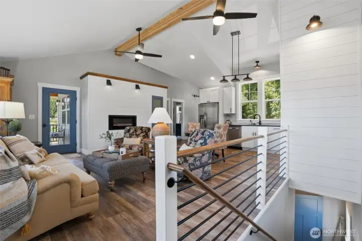Such a lovely place to host guests or work from home! Vaulted ceilings and vinyl plank flooring, as well as SS kitchen appliances and beautiful wood accents, give this space such warmth and comfort. An electric wall fireplace and shiplap accents add to the ambiance and charm of this room. Such a lovely place to host guests or work from home! Vaulted ceilings and vinyl plank flooring, as well as SS kitchen appliances and beautiful wood accents, give this space such warmth and comfort. An electric wall fireplace and shiplap accents add to the ambiance and charm of this room.