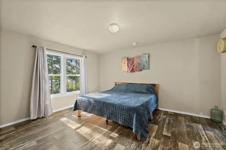 Primary bedroom with views of Mission Lake.