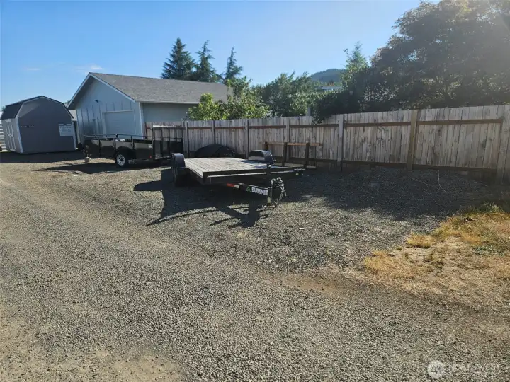 Plenty of additional parking behind the shop- big enough for an RV