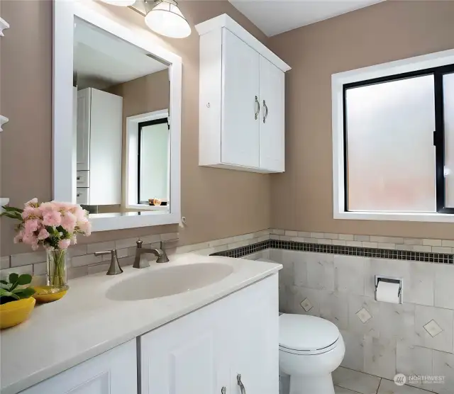 You'll appreciate the gorgeous tile details in the primary bath, along with heated floors and a jetted tub.