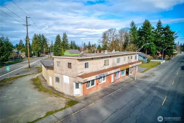 Dynamic mixed-use asset in Everett’s revitalizing urban core. Interurban Crossing spans a 26,572 SF corner lot with alley access, 20+ parking spaces, and a 7,629 SF structure leased to stable local tenants—3 storefronts, 3 apartments, and 3 flex spaces. Current gross rent over $64K; pro forma $144K+ with light upgrades. Just 26.3% lot coverage—NB zoning + Opportunity Zone offer phased development potential. Steps from the Interurban Trail, future light rail, and new stadium district. A walkable, well-connected location with built-in income and big upside.