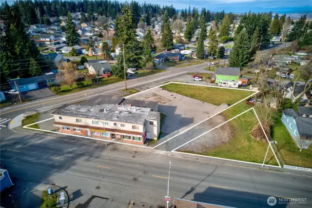 Dynamic mixed-use asset in Everett’s revitalizing urban core. Interurban Crossing spans a 26,572 SF corner lot with alley access, 20+ parking spaces, and a 7,629 SF structure leased to stable local tenants—3 storefronts, 3 apartments, and 3 flex spaces. Current gross rent over $64K; pro forma $144K+ with light upgrades. Just 26.3% lot coverage—NB zoning + Opportunity Zone offer phased development potential. Steps from the Interurban Trail, future light rail, and new stadium district. A walkable, well-connected location with built-in income and big upside.