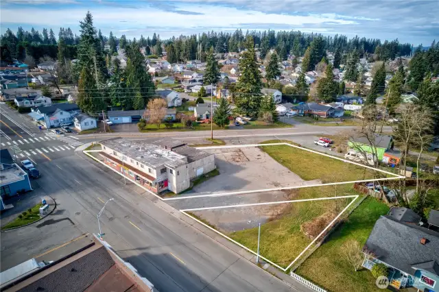 Dynamic mixed-use asset in Everett’s revitalizing urban core. Interurban Crossing spans a 26,572 SF corner lot with alley access, 20+ parking spaces, and a 7,629 SF structure leased to stable local tenants—3 storefronts, 3 apartments, and 3 flex spaces. Current gross rent over $64K; pro forma $144K+ with light upgrades. Just 26.3% lot coverage—NB zoning + Opportunity Zone offer phased development potential. Steps from the Interurban Trail, future light rail, and new stadium district. A walkable, well-connected location with built-in income and big upside.