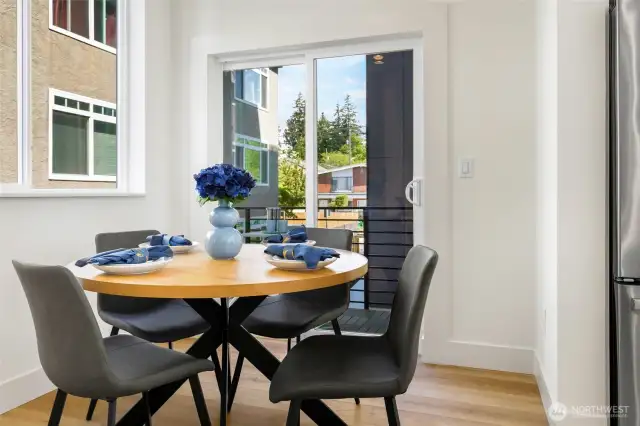 Dining area leading to private balcony.