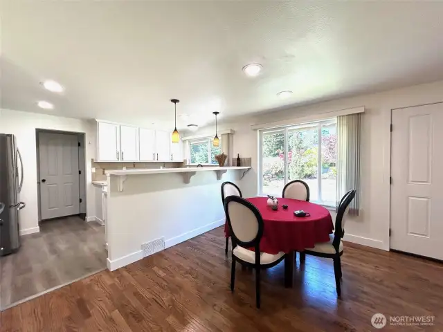 dining room and kitchen. new flooring, kitchen counters, new appliances