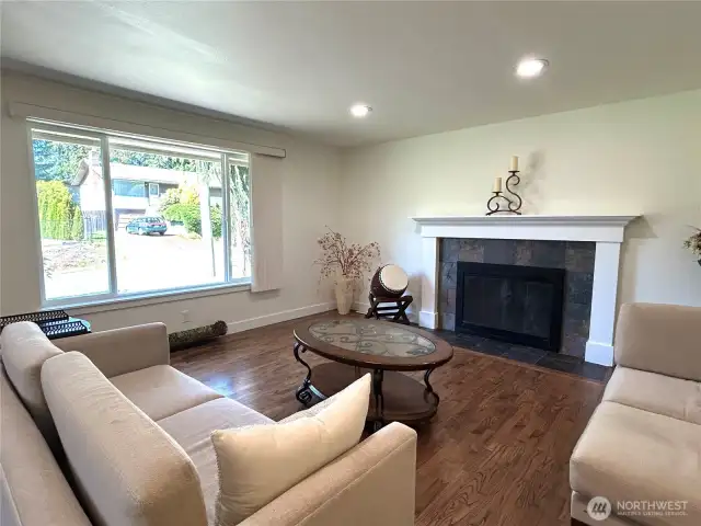 living room with woodburning fireplace