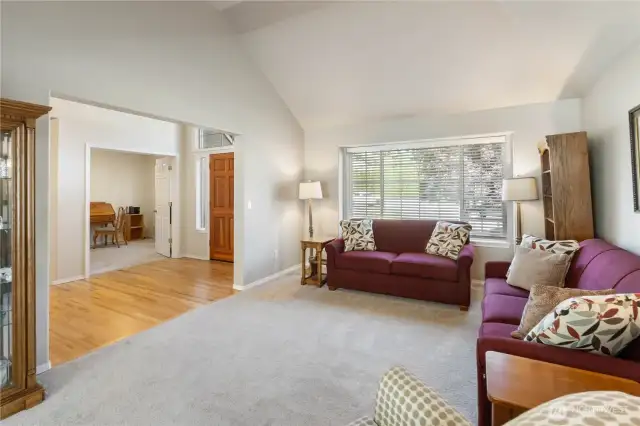 Across the hall, French doors open to a versatile den or home office—an ideal space for remote work or quiet study.