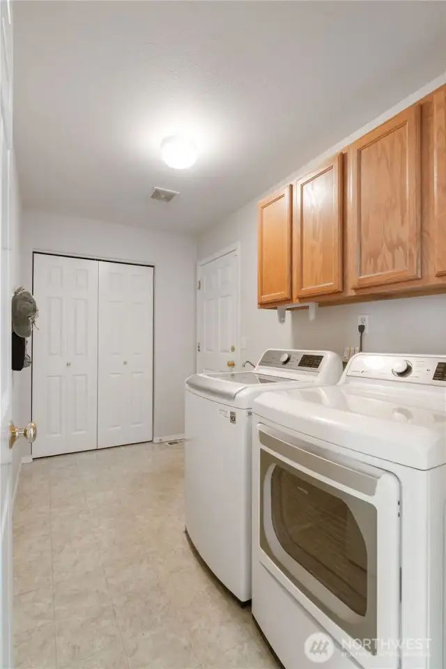 A conveniently located main-floor laundry room sits just off the garage, offering practicality and ease for everyday living.